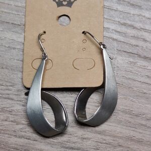 A pair of silver dangle earrings